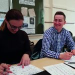 Two people working at a desk